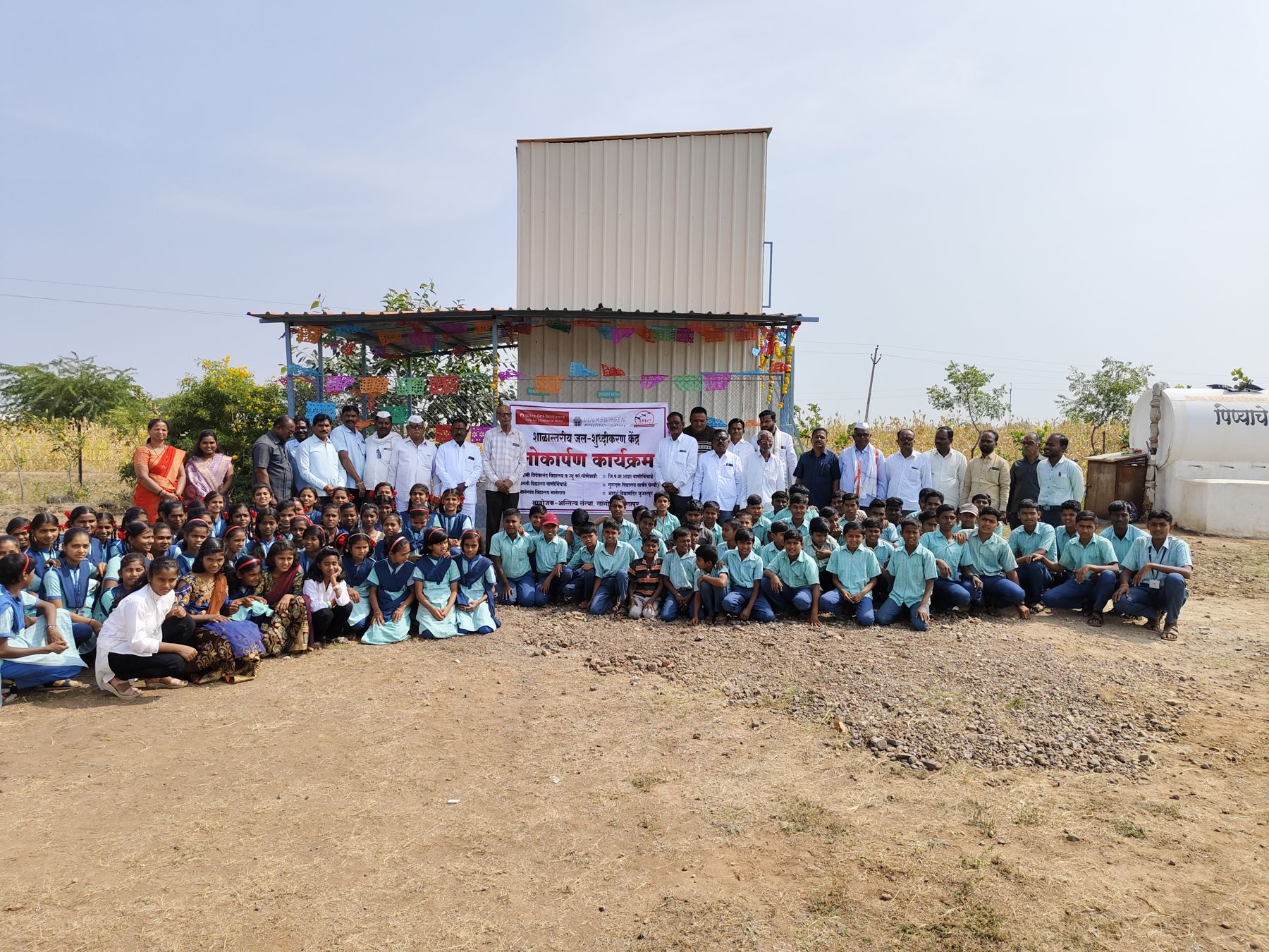 Students and villagers at the opening of a school water purification centre